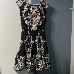 Jovani short black dress with light pink design and rhinestones. Size 4